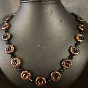 Hand made brown and black necklace. 22” long
